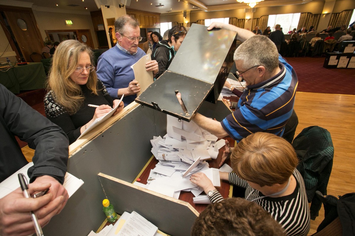 270216 Count Official Gerry Lee, Ennis, opens boxes at The Falls Hotel Ennistymon Co Clare Count Centre on Saturday morning.Pic Arthur Ellis/Press22.