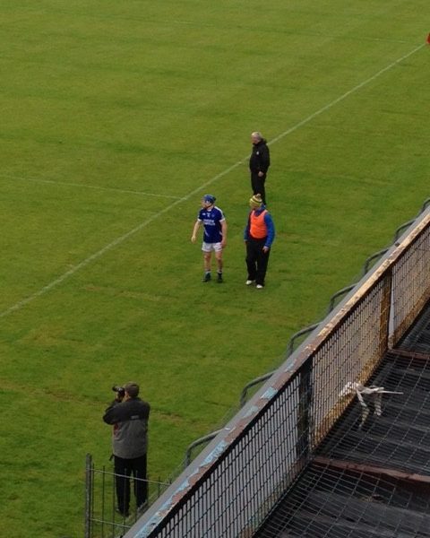 Podge Collins leaves the field after damaging his cruciate ligament. 