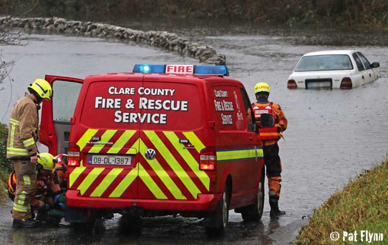 Women rescued from car trapped in flood