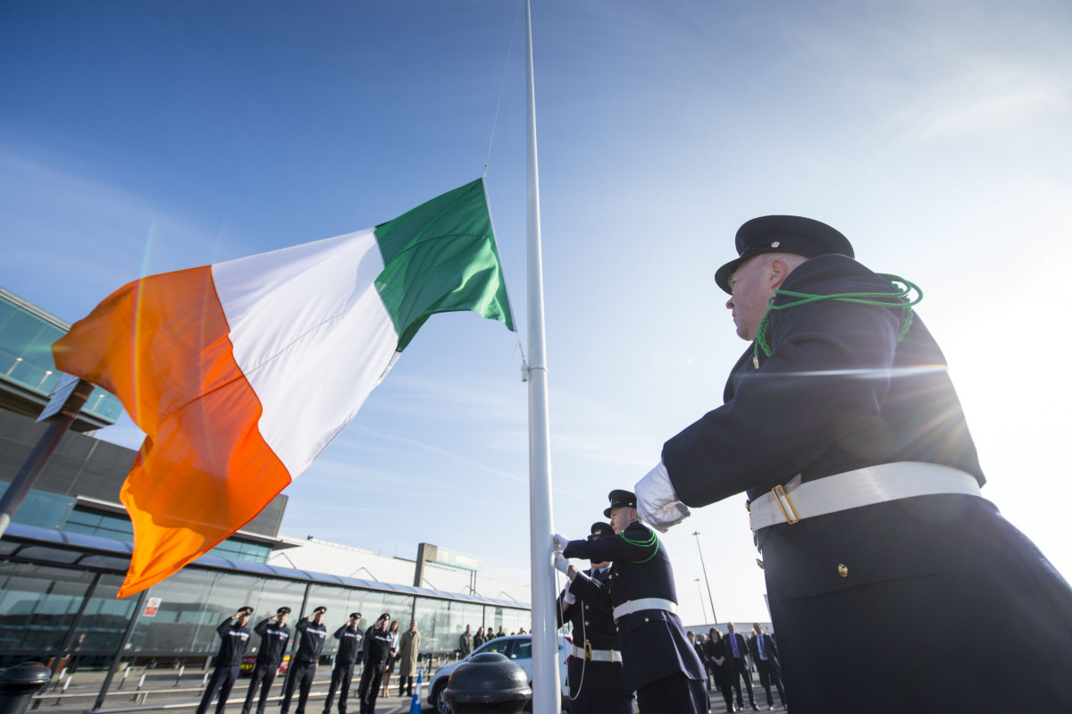 Pictured during the flag-raising ceremony are Shannon Airport Police officers, from left, Brian Corry, from Newmarket-on-Fergus, Co. Clare, David McNamara, from Kilkishen, Co. Clare, and Richard Moloney, from Bruff, Co. Limerick. Shannon Airport, Co. Clare. Picture credit: Diarmuid Greene/Fusionshooters