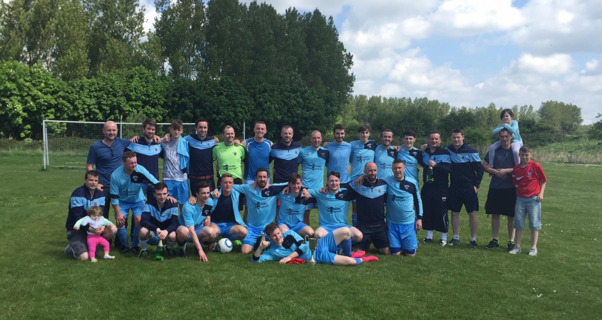 Shannon Town A celebrating their promotion in May.