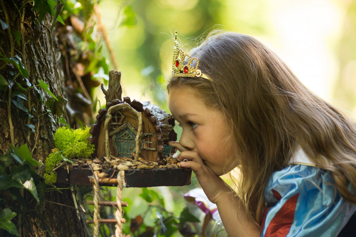 Eve O'Gorman age 5 from Cratloe, Co. Clare looking for fairies after discovering the magical fairy village right in the heart of the Folk Park. Pic Sean Curtin FusionShooters