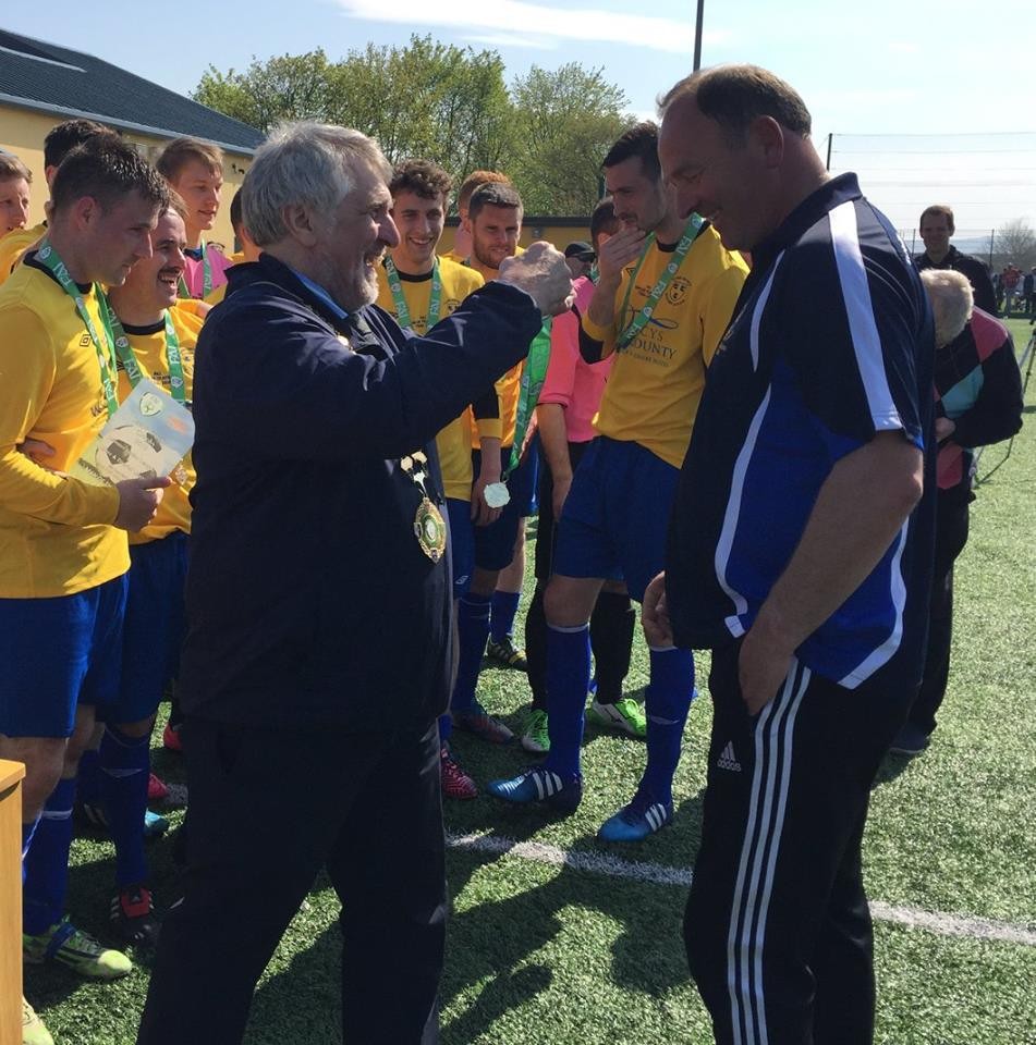 Donie Garrihy receiving a medal for Clare's Oscar Traynor success.