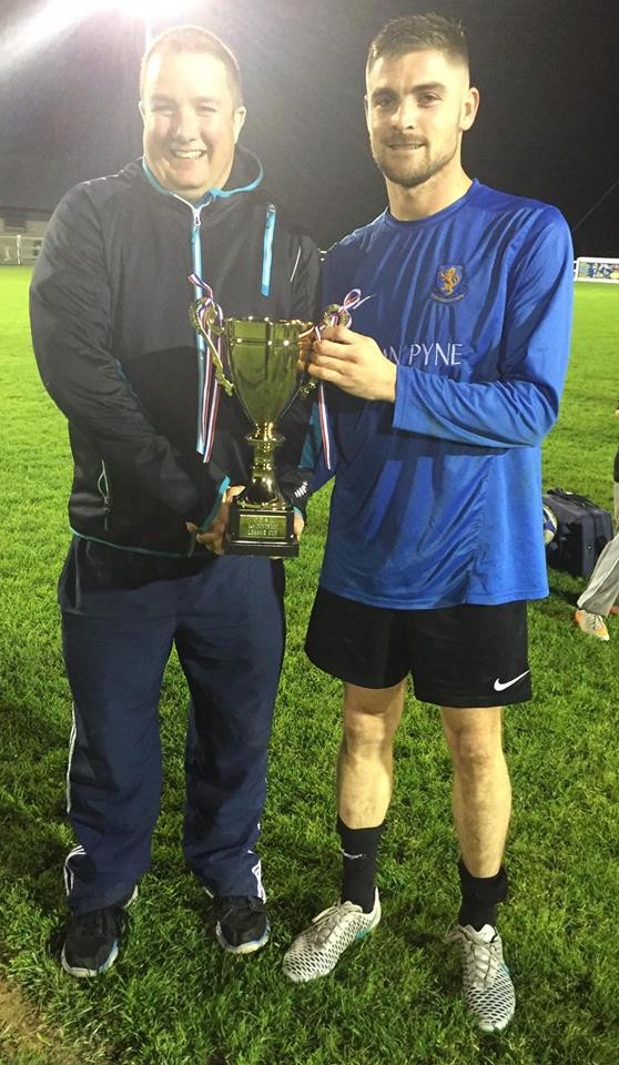 Turnpike's David McMahon receives the First Division League Cup trophy from Frank Gormley