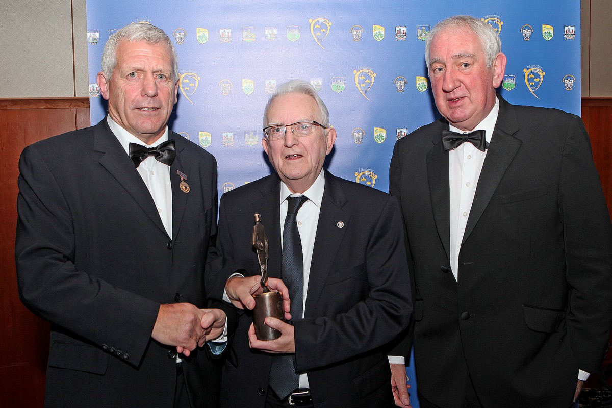 Micheál Mac Conmara accepting a Special Service Award from Munster GAA Chairman Jerry O’Sullivan at the 2016 Munster GAA Awards held on. Also in the photo is Munster GAA Treasurer Anthony Walsh.